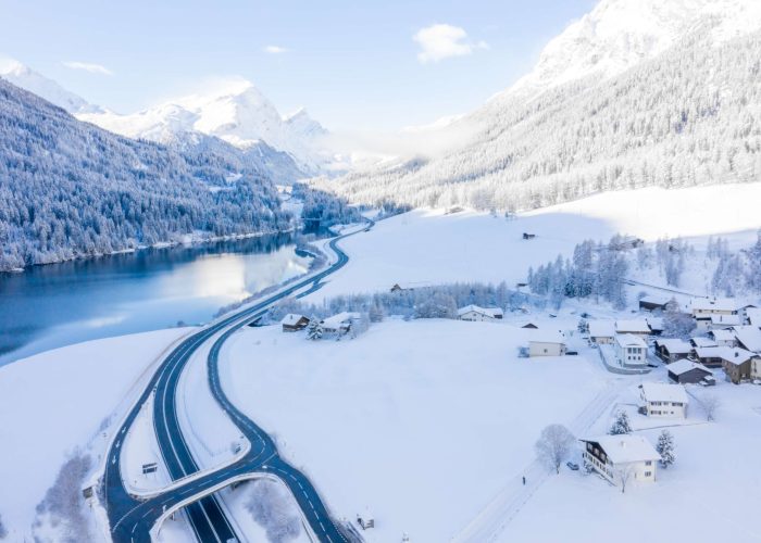 magical-switzerland-winter-lake-center-alps-surrounded-by-forest-covered-by-snow (1)